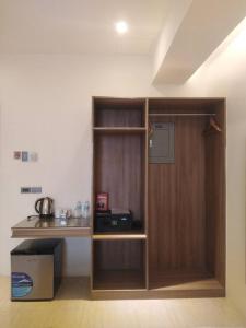a room with a wooden door and a counter at Eastland Hotel And Residences in Cebu City