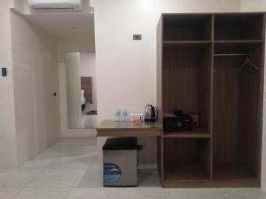 a kitchen with a counter and a sink in a room at Eastland Hotel And Residences in Cebu City