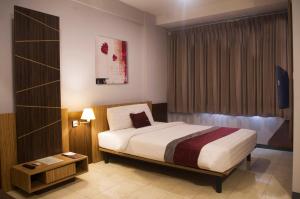 Voodi või voodid majutusasutuse Valore Hotel toas