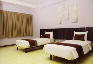 Voodi või voodid majutusasutuse Valore Hotel toas