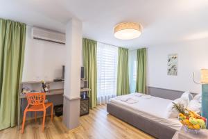 Postel nebo postele na pokoji v ubytování BSA Boulevard Boutique