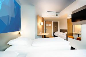 Postel nebo postele na pokoji v ubytování B&B Hotel Stuttgart-Vaihingen + 23 fotografií
