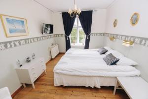 Krevet ili kreveti u jedinici u okviru objekta Mjällbyhus Pensionat & Stugby