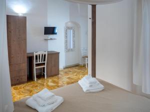 Postel nebo postele na pokoji v ubytování Lucente Rooms & Suites + 37 fotografií