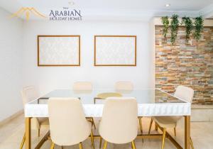 Posezení v ubytování New Arabian Trident Waterfront 3 BR plus maid