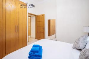 Postel nebo postele na pokoji v ubytování New Arabian Trident Waterfront 3 BR plus maid