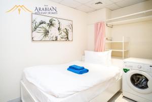 Postel nebo postele na pokoji v ubytování New Arabian Trident Waterfront 3 BR plus maid