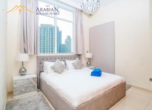Postel nebo postele na pokoji v ubytování New Arabian Trident Waterfront 3 BR plus maid