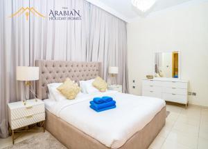 Postel nebo postele na pokoji v ubytování New Arabian Trident Waterfront 3 BR plus maid