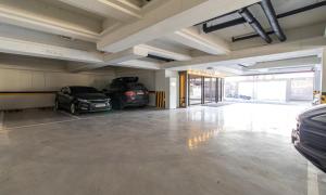 a garage with two cars parked in it at Hwaseong Stay13 Hotel in Hwaseong