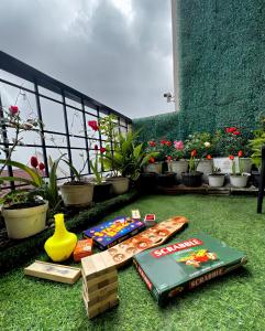 a table with snacks and a book on the grass at A Perfect Stay to Escape the City in Baguio