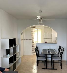 a dining room with a table and chairs at Playa Flamenca 2 bed Apt Sol De Mar in Villamartin