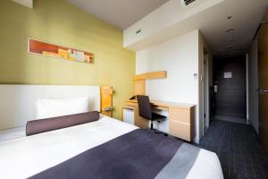 a hotel room with a bed and a desk at Tokyu Stay Kamata - Tokyo Haneda in Tokyo