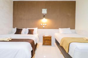 Katil atau katil-katil dalam bilik di Hotel Safara Yogyakarta