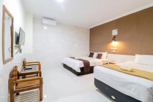 Katil atau katil-katil dalam bilik di Hotel Safara Yogyakarta