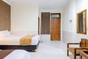 Katil atau katil-katil dalam bilik di Hotel Safara Yogyakarta