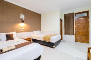 Katil atau katil-katil dalam bilik di Hotel Safara Yogyakarta