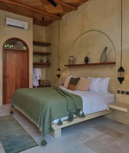 a bedroom with a large bed in a room at Lina Boutique Villas and Spa in Kuta Lombok