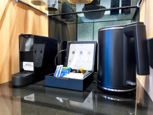 a counter top with a computer on top of it at Hotel Royal Signature in Kuala Lumpur