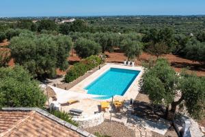 an aerial view of a swimming pool in a villa at Trullo Fantastico in Castellana Grotte