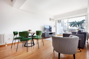 a living room with a table and chairs at NOA - Sungu 1 in Istanbul +78 photos