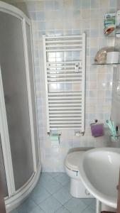 a bathroom with a shower and a toilet and a sink at Appartamento ITACA - CITRA 08065-LT-0722 in Ventimiglia +18 photos