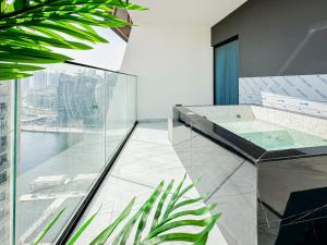 a bathroom with a jacuzzi tub in a building at Trophy - Luxury Casa Cielo Suites in Dubai