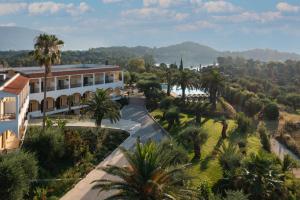 an aerial view of a building and palm trees at Paradise Hotel Corfu in Gouvia