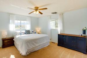 a bedroom with a bed and a ceiling fan at Cortez Retreat with Office and Stunning Mtn Views in Cortez