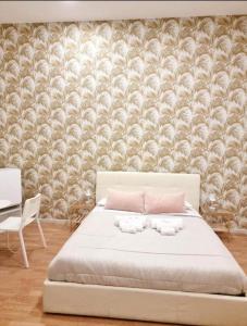 Letto o letti in una camera di DOMUS LUIGI LEONE 2