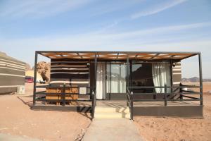 a small building in the middle of the desert at Sun City Camp in Wadi Rum