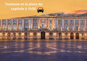 a large building with a bus in front of it at Le Victor Hugo Appartement T3 proche Musée Soulages in Rodez