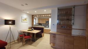 a kitchen with a table and a dining room at Living & Relax Resorts in Sausal