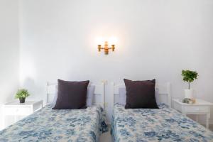 A bed or beds in a room at Casa Drago, Belleza y Tranquilidad