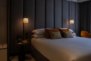 Postel nebo postele na pokoji v ubytování Deep Blu Boutique Hotel