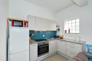Kuchyň nebo kuchyňský kout v ubytování Horizonte apartman