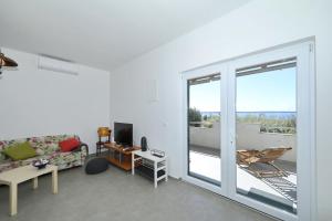 TV a/nebo společenská místnost v ubytování Horizonte apartman