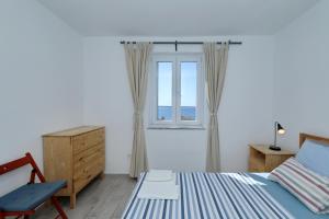 Postel nebo postele na pokoji v ubytování Horizonte apartman