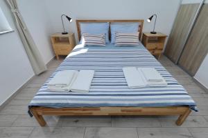 Postel nebo postele na pokoji v ubytování Horizonte apartman