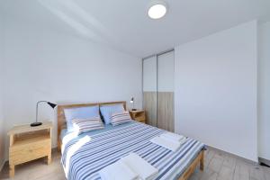 Postel nebo postele na pokoji v ubytování Horizonte apartman
