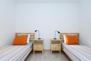 Postel nebo postele na pokoji v ubytování Horizonte apartman