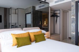 Postel nebo postele na pokoji v ubytování Deep Blu Boutique Hotel