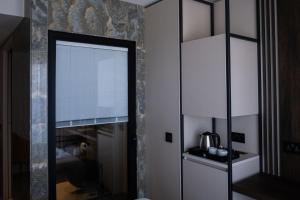 Kuchyň nebo kuchyňský kout v ubytování Deep Blu Boutique Hotel
