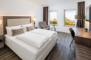 Säng eller sängar i ett rum på Hotel Newton Ludwigshafen