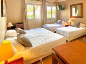 a hotel room with two beds and a window at Villa Rambouillet in Rambouillet +88 photos