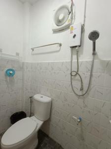 a bathroom with a toilet and a shower at Homehana Pua in Pua