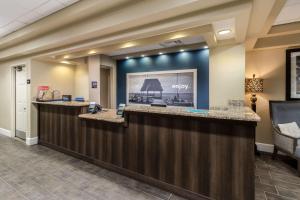 a lobby of a hyatt hotel with a reception counter at Hampton Inn Daytona Shores-Oceanfront in Daytona Beach