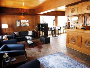 a living room with a couch and a table at Nice studio near Luxembourg in Bollendorf