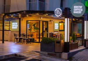 a restaurant with a patio with tables and chairs at Alan Suites in Edirne