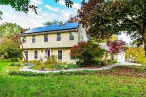 a house with solar panels on the roof at Centrally Located Luxury House in Ann Arbor